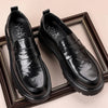 Herreloafers i læder med penny-rem og mock-toe-mønster