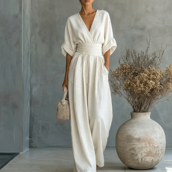Figursmigrende jumpsuit med V-udskæring