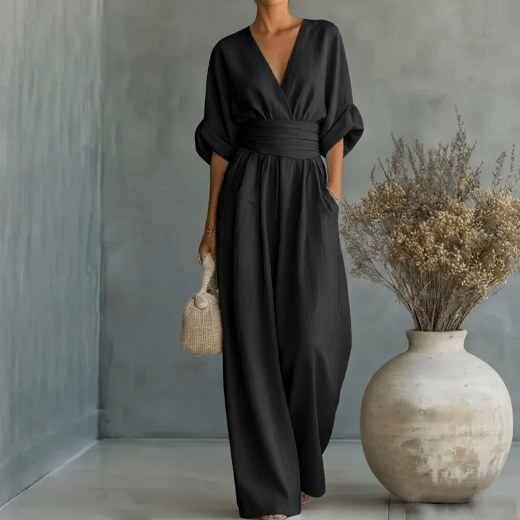 Figursmigrende jumpsuit med V-udskæring